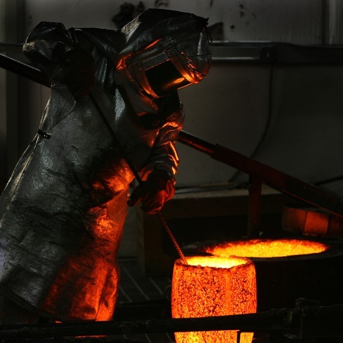 Steve Griffin  |  The Salt Lake Tribune

A vessel containing bronze at Adonis Bronze is raised from a furnace. The foundry is casting the statues sculpted by Brad Taggart that will be part of the Taylorsville Veterans Memorial.