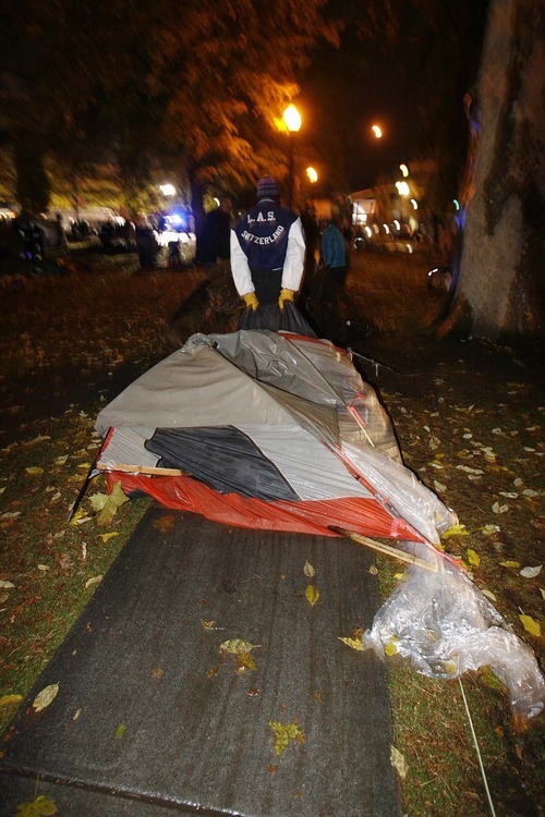 Trent Nelson  |  The Salt Lake Tribune
A tent is dragged off as Salt Lake City police cleared the Occupy Salt Lake tent city from Pioneer Park in Salt Lake City, Utah, Saturday, November 12, 2011.