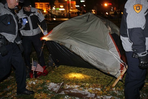 Trent Nelson  |  The Salt Lake Tribune
Salt Lake City police search tents as they clear the Occupy Salt Lake tent city from Pioneer Park in Salt Lake City, Utah, Saturday, November 12, 2011.