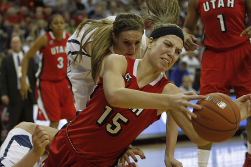 Rick Egan | Tribune file photo
Michelle Plouffe goes to a floor for a loose ball during a win over BYU in last season's Mountain West Conference tournament.