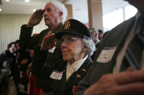 Kim Raff  |  The Salt Lake Tribune
Ora Mae Hyatt, a U.S. Army nurse during World War II, salutes during the Pledge of Allegiance during the Veterans Day Celebration at the University of Utah in Salt Lake City on Friday.