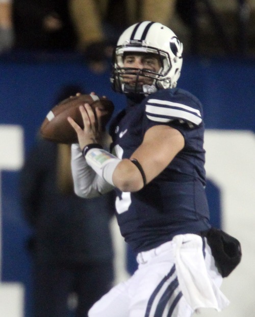 Rick Egan  | The Salt Lake Tribune 

Brigham Young Cougars quarterback Jake Heaps (9)throws the ball for the cougars, in football action, BYU vs. the Idaho Vandals football game at Lavell Edwards Stadium, Saturday, November 12, 2011.
