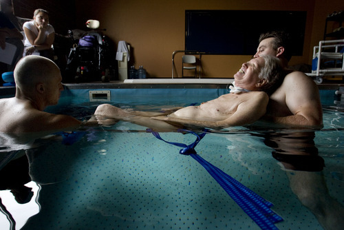 Steve Griffin  |  The Salt Lake Tribune


Brooke Hopkins, who was paralyzed from a bicycle accident three years ago, struggles to complete an exercise as he works with physical therapist Matt Hansen, left, and LMT/PT Aide Mike Erickson during pool therapy at Neuroworx in South Jordan, Utah Friday, November 11, 2011.