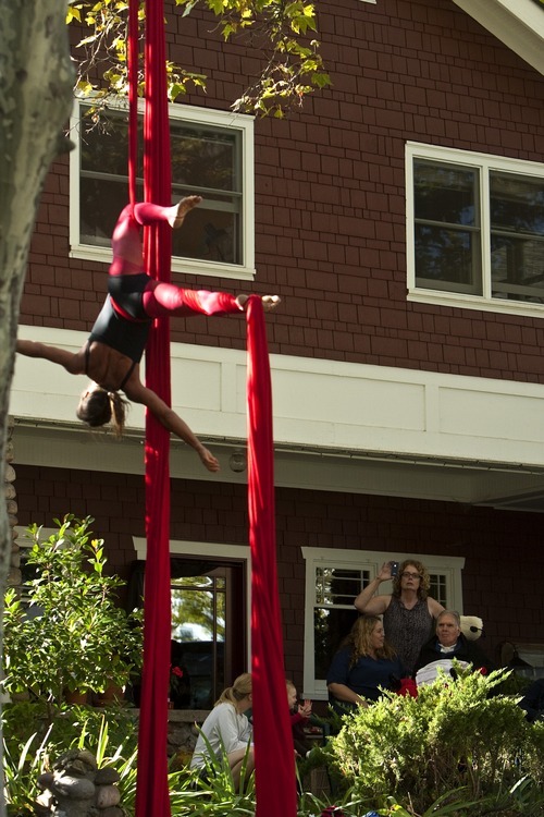Chris Detrick  |  The Salt Lake Tribune
With family and friends by his side, Brooke Hopkins watches as Aerial Arts of Utah member Deborah Eppstein performs at Hopkins' home in the Avenues Wednesday October 19, 2011.