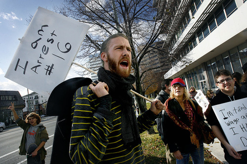 Scott Sommerdorf  |  The Salt Lake Tribune             
Occupy SLC protester Michael Wilson, who was arrested Saturday night when the camp was emptied, speaks at the Salt Lake Public Safety Building Sunday. The group had earlier marched from the City Library past City Hall.