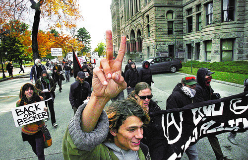 Scott Sommerdorf  |  The Salt Lake Tribune             
Occupy SLC protesters march past City hall before heading to the Salt Lake Public Safety Building Sunday.