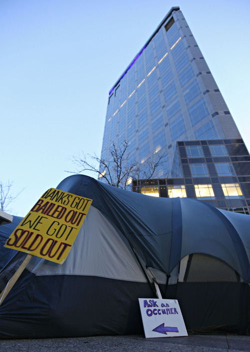Lennie Mahler  |  The Salt Lake Tribune
A tent stands in front of the Wells Fargo Tower at the Gallivan Center where protesters have set up a political action front. Tents are permitted to protect protesters and their belongings from the weather, but they are not allowed to cook food or sleep overnight, among activities that would qualify it as an encampment.