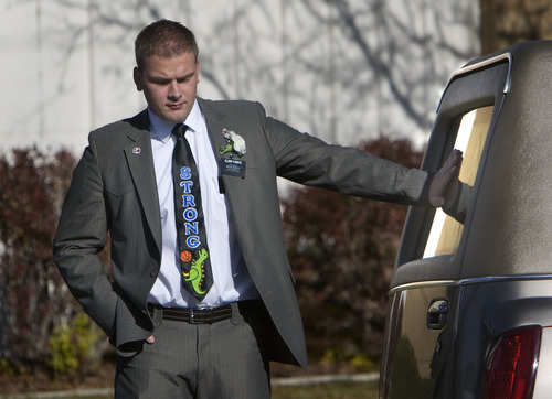 Steve Griffin  |  The Salt Lake Tribune

Scott Strong rests his hand on the window of the hearse carrying the casket of his twin brother, Trevor Strong, after funeral services at an LDS Stake Center in Kearns on Monday, Nov. 14, 2011. Trevor Strong was an LDS missionary who died after being struck by a car while serving his mission in Texas.