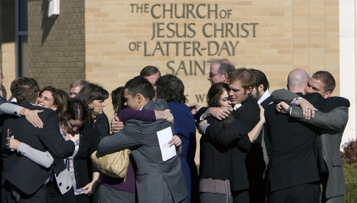 Steve Griffin  |  The Salt Lake Tribune

Family and friends of Trevor Strong, an LDS missionary who died after being struck by a car while serving his mission in Texas, embrace outside the LDS Stake Center in Kearns on Monday, Nov. 14, 2011.