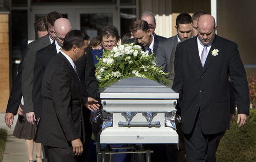 Steve Griffin  |  The Salt Lake Tribune

Pallbearers carry the casket of Trevor Strong, an LDS missionary who died after being struck by a car while serving his mission in Texas, after funeral services at an LDS Stake Center in Kearns on Monday, Nov. 14, 2011.