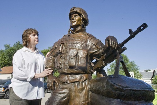 Paul Fraughton  |  The Salt Lake Tribune
Sculptor Lena Toritch stands next to her bronze statue of Spc. John Borbonus,  a soldier killed in Iraq in 2007.  The statue will be driven to Cascade, Idaho, the soldier's home town, to be placed in a park as a memorial.