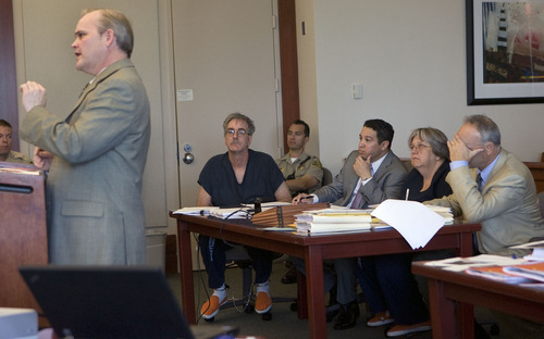 Al Hartmann  |  The Salt Lake Tribune
Prosecuter Chad Platt left, questions a witness as defendants Dale Beckering, left, sits with lawyer Rudy Baustista, and Sherrie Beckering sits with her lawyer David Berceaua in Judge Leon Dever's Third District Court in Salt Lake City Friday, June 3. The Beckerings are charged with aggravated abuse of a disabled adult for the March death of 22-year-old Christina Harms.
