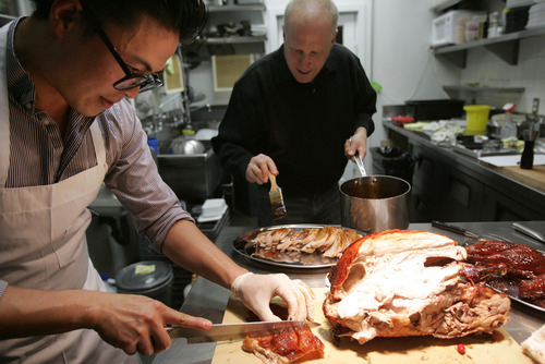 Kim Raff | The Salt Lake Tribune
David Cole, co-owner of Epic Brewing, back, brined the turkey in beer. Viet Pham, chef of Forage in Salt Lake City, prepared the dish from there.