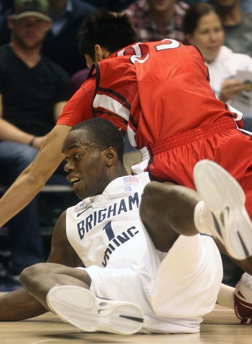 Steve Griffin  |  The Salt Lake Tribune


BYU's Charles Abouo, bottom and BYU-Hawaii's Jet Chang dive for a loose ball during first half action in the BYU versus BYU Hawaii basketball game at the Marriott Center in Provo, Utah Tuesday, November 15, 2011.