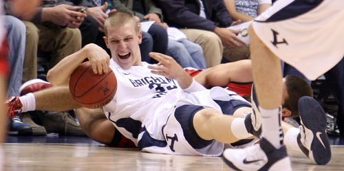 Steve Griffin  |  The Salt Lake Tribune


BYU's Nate Austin grabs a loose ball during first half action in the BYU versus BYU Hawaii basketball game at the Marriott Center in Provo, Utah Tuesday, November 15, 2011.