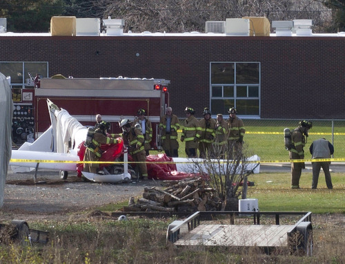 Tribune file photo
Emergency personnel respond to a plane crash near an elementary school in Payson last year. Federal investigators have yet to conclude the probe into the cause of the fatal accident.