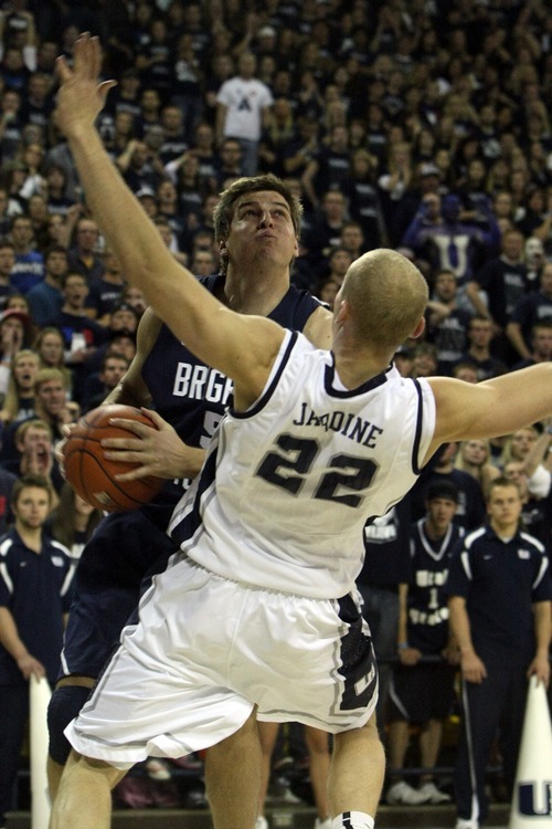 Chris Detrick  |  The Salt Lake Tribune
Brigham Young Cougars forward Chris Collinsworth (5) fouls Utah State Aggies forward Brady Jardine (22) during the second half of the game at the Dee Glen Smith Spectrum Friday November 11, 2011. Utah State won the game 69-62.