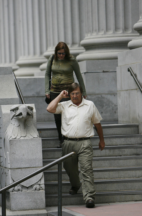 Salt Lake City - David A. Lacy, brother of San Juan County Sheriff Mike Lacy, leaves Federal Court along with his wife in Salt Lake as one of the defendants named in the alleged looting of artifacts on Wednesday, June 17, 2009.  Lacy faces 7 felonies and two misdemeanors steming from the charges against him.  Photo by Francisco Kjolseth/The Salt Lake Tribune 6/17/2009