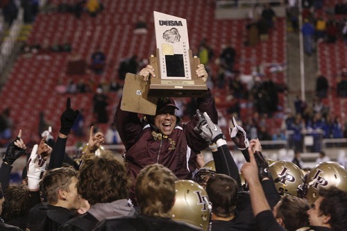 Chris Detrick  |  The Salt Lake Tribune
Lone Peak head coach Tony McGear celebrates with his team after the 5A Championship game at Rice-Eccles Stadium  Friday November 18, 2011.  Lone Peak defeated Fremont 41-21.