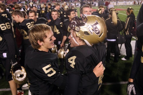 Chris Detrick  |  The Salt Lake Tribune
Lone Peak's Tanner Smith (5) and Lone Peak's Matt  Gowdy (4) celebrate after the 5A Championship game at Rice-Eccles Stadium  Friday November 18, 2011.  Lone Peak defeated Fremont 41-21.