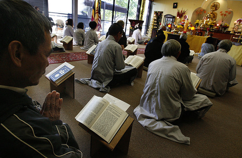 Scott Sommerdorf  |  The Salt Lake Tribune             
Morning service inside the Pho Quang Pagoda Buddhist temple in Salt Lake City, Sunday, November 6, 2011. A dispute over ownership of the temple has led Vietnamese congregation members who have worshiped there for 18 years to be, effectively, evicted. The complex dispute is headed to a January trial.