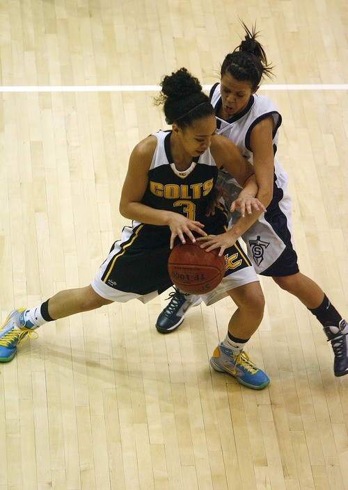 Djamila Grossman  |  The Salt Lake Tribune
Cottonwood High School's Kristina Hosea, 3, guards the ball against Syracuse High School's Hailee Parry, 2, during a game in the state tournament at Salt Lake Community College in Taylorsville. Syracuse won the game.