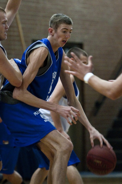 Chris Detrick  |  The Salt Lake Tribune
Pleasant Grove's 7-foot senior center Alan Hamson drives to the basket during a practice Wednesday November 16, 2011.