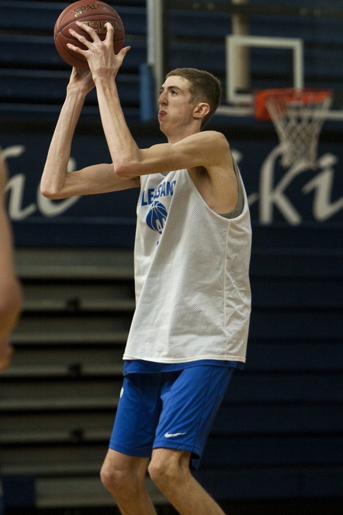 Chris Detrick  |  The Salt Lake Tribune
Pleasant Grove's 7-foot senior center Alan Hamson shoots the ball during a practice Wednesday November 16, 2011.