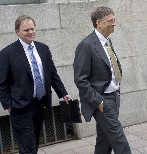 Al Hartmann  |  The Salt Lake Tribune
Bill Gates, right, is escorted by John Pinette from federal court in Salt Lake City on Monda, Nov. 21 after the first day testimony in a lawsuit pitting Novell against Microsoft.