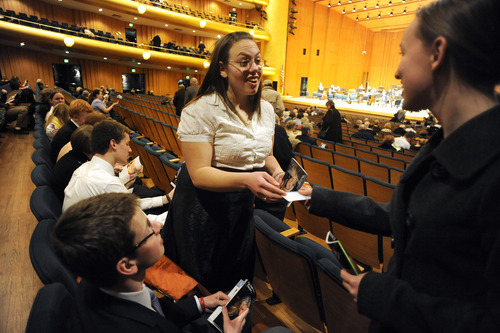 Sarah A. Miller  |  The Salt Lake Tribune

Shanae Tate, 17, gives a program to Hanne Blomgren, 15, at the Salt Lake Symphony concert at Abravanel Hall in Salt Lake City Friday, February 3, 2011. The students are members of the new West High School Symphony Club.