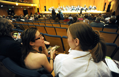 Sarah A. Miller  |  The Salt Lake Tribune
Annie Cherkaev, 18, and Hannah Ellingson, 16, talk before the Utah Symphony concert at Abravanel Hall in Salt Lake City Friday, February 3, 2011. The students are members of the new West High School Symphony Club.
