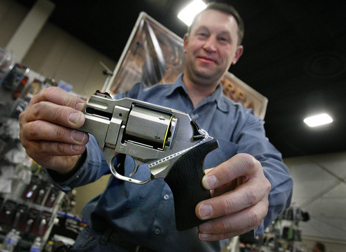 Scott Sommerdorf  |  The Salt Lake Tribune             
Ray Saunders, owner of Sierra Guns & Hunting Gear, holds a new Chiappa 