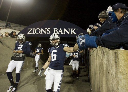 Kim Raff | The Salt Lake Tribune
BYU player wide receiver McKay Jacobson visits with fans while entering the field to warm up during a game against New Mexico State football in Provo, Utah on Saturday, November 19, 2011.