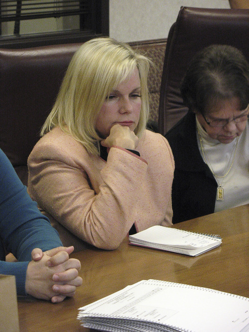 Donald W. Meyers | The Salt Lake Tribune 
Provo Municipal Council District 1 candidate Bonnie Morrow watches as county workers hand count the ballots in her race with Gary Winterton Wednesday. County election officials opted for a manual recount after optical scanners showed discrepancies in the results between Gary Winterton and Morrow. Morrow requested the recount after falling nine votes behind Winterton.