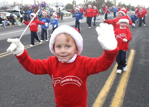 Rick Egan  | The Salt Lake Tribune 

Noah Thomas, 5, marches with Miss Margene's creative generation musical theater, in the West Valley Christmas Parade, Friday, November 25, 2011.