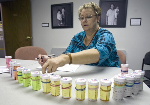 Al Hartmann  |  The Salt Lake Tribune
Registered Nurse Debbie Sorensen with Salt Lake County Health Department's infectious disease organizes medications for the latent tuberculosis infection program for refugees at the International Rescue Agency in Salt Lake City.