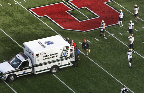 Scott Sommerdorf  |  The Salt Lake Tribune             
Utah players watch as an ambulance carrying teammate Sam Brenner leaves the field after the beginning of the second half Friday, Nov. 25, 2011.