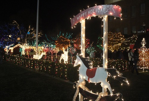 Rick Egan  | The Salt Lake Tribune 
The lights of the Christmas Village, in the Municipal Gardens in Ogden, were lit when Santa flipped the switch after the annual Holiday Electric Light Parade on Washington Boulevard on Saturday. Ogden has re-created Santa's village at the North Pole since 1962.