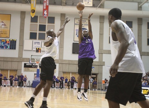 Rick Egan  | The Salt Lake Tribune 

Al Jefferson scores over Anthony Tolliver, in the NBA lockout charity exhibition game at Lifetime Activities Center at Salt Lake Community College, Monday, November 7, 2011.