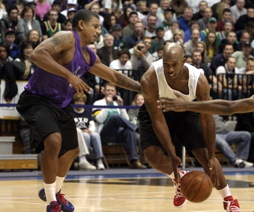 Rick Egan  | The Salt Lake Tribune 

Ear Watson defends for Utah, as Chauncy Billups drives with the ball, in the NBA lockout charity exhibition game at Lifetime Activities Center at Salt Lake Community College, Monday, November 7, 2011.