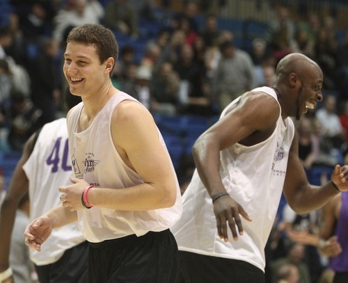 Rick Egan  | The Salt Lake Tribune 

Jimmer Fredette smiles along with team mate Anthony Tolliver,  the NBA lockout charity exhibition game at Lifetime Activities Center at Salt Lake Community College, Monday, November 7, 2011.