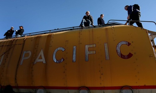 Leah Hogsten | The Salt Lake Tribune  
Onlookers watch as Union Pacific's 844, a historic steam engine,  arrives Saturday at Ogden's Union Station.