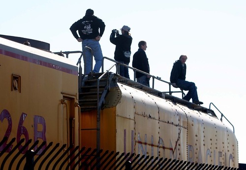 Leah Hogsten | The Salt Lake Tribune  
Onlookers watch as Union Pacific's 844, a historic steam engine,  arrives Saturday at Ogden's Union Station.