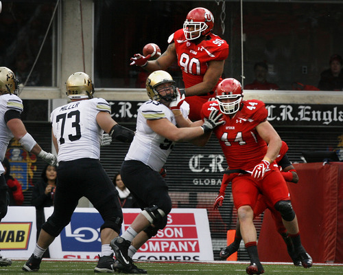 Scott Sommerdorf  |  The Salt Lake Tribune             
Utah Utes defensive end Derrick Shelby (90) went high, and almost blocked this pass by Colorado Buffaloes quarterback Tyler Hansen (9) during forst half play. Colorado held a 10-0 lead over Utah at the half, Friday, November 25, 2011.