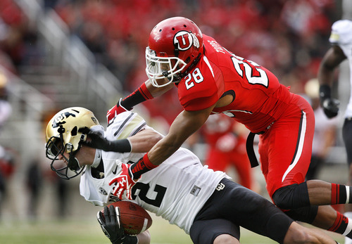 Scott Sommerdorf  |  The Salt Lake Tribune             
Utah Utes defensive back Reggie Topps (28) tackles Colorado Buffaloes wide receiver Logan Gray (2) after a catch during first half play. Colorado held a 10-0 lead over Utah at the half, Friday, November 25, 2011.