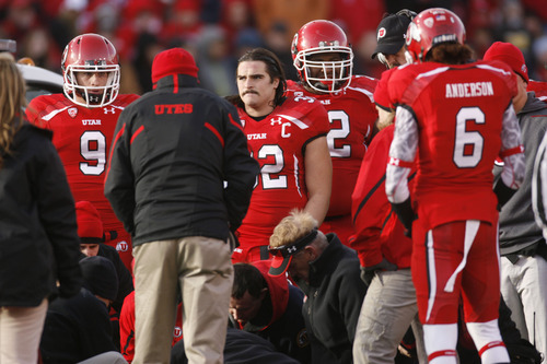 Trent Nelson  |  The Salt Lake Tribune
Utah players, including Chaz Walker, center, watch as teammate Sam Brenner is taken from the field in an ambulance during the third quarter, Utah vs. Colorado, college football at Rice-Eccles Stadium in Salt Lake City, Utah, Friday, November 25, 2011