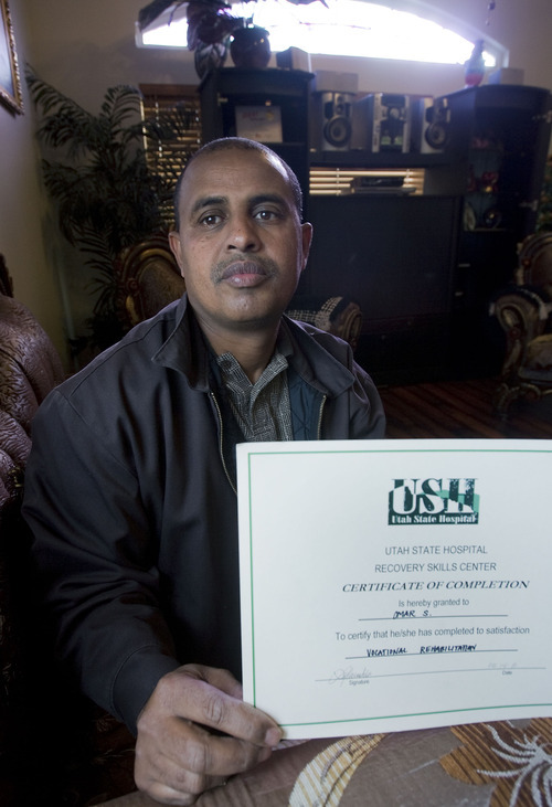 AAl Hartmann  |  The Salt Lake Tribune
Almoh Bahaji ponders the death of his nephew, Omar Sharif, who was allegedly murdered at the Utah State Hospital for the mentally ill last spring. After eight months, the family has felt ignored because no information about the case has been provided to them. He holds a certificate from the hospital that states his nephew's completion of a vocational rehabiltiation program.