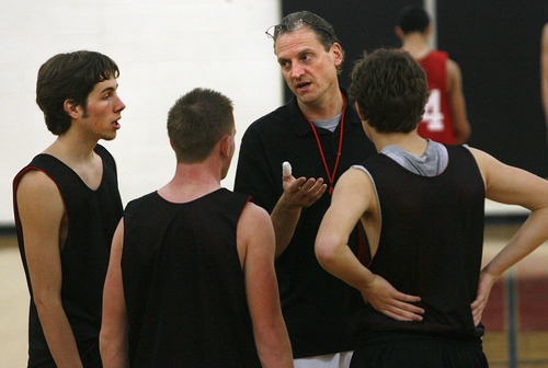 Scott Sommerdorf  |  The Salt Lake Tribune             
West boys basketball coach Mike Matheson talks with his team captains for 2011, Lennon Coley, left, Zach Floisand, and Devin Price, right, at practice at West Monday, November 28, 2011.