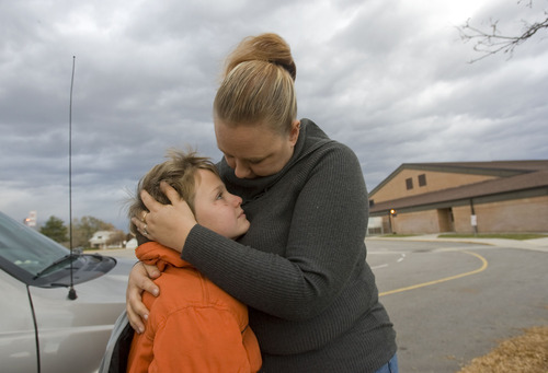 Al Hartmann  |  The Salt Lake Tribune
McKayde Mortensen gives his mother Tricia Mortensen a hug as he's dropped off at school in Magna. He developed PTSD after witnessing his mother in a car accident. He doesn't get upset about getting in the car anymore, but he's still close to his mother. 