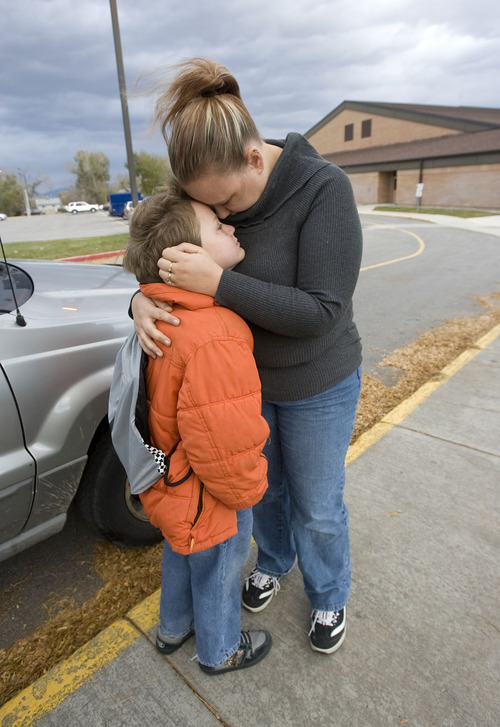 Al Hartmann  |  The Salt Lake Tribune
McKayde Mortensen gives his mother Tricia Mortensen a hug as he's dropped off at school in Magna.  He developed PTSD after watching his mother get in a car accident. Now 8, he recently completed therapy and remains close to his mother. 